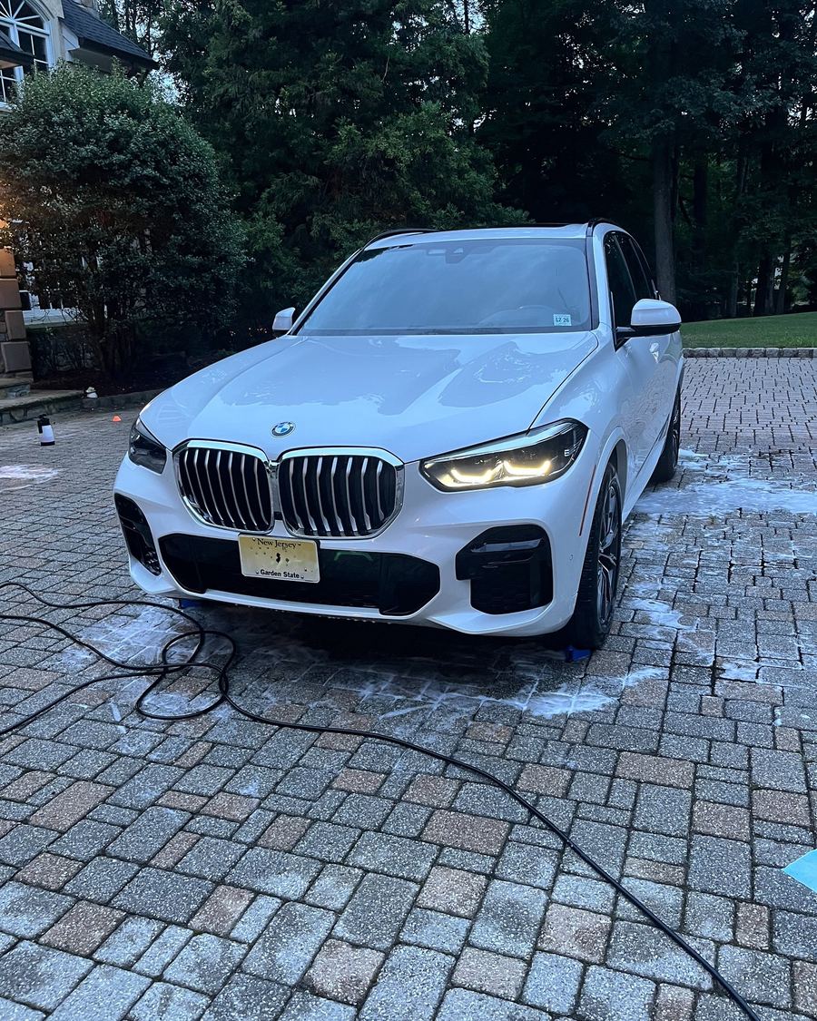 A white BMW SUV after a Precision Shine wash