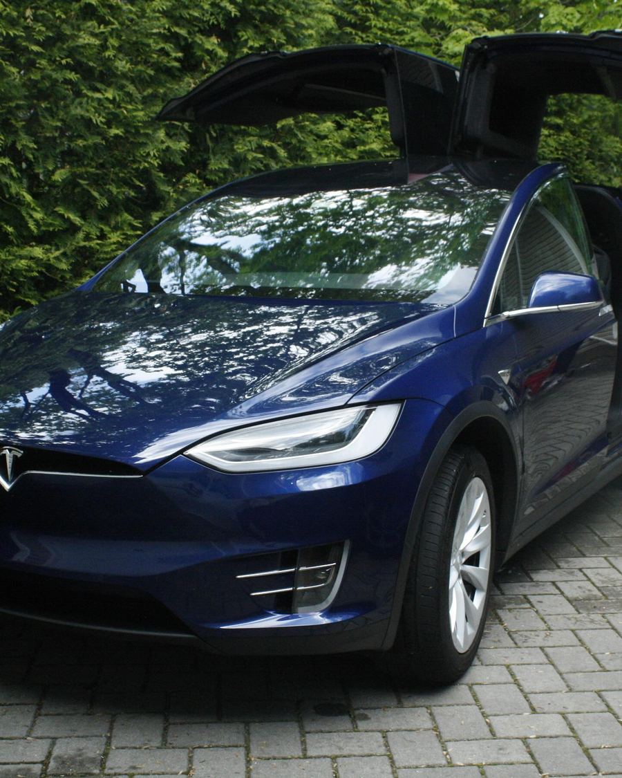 A blue Tesla Model X after a Precision Shine detail